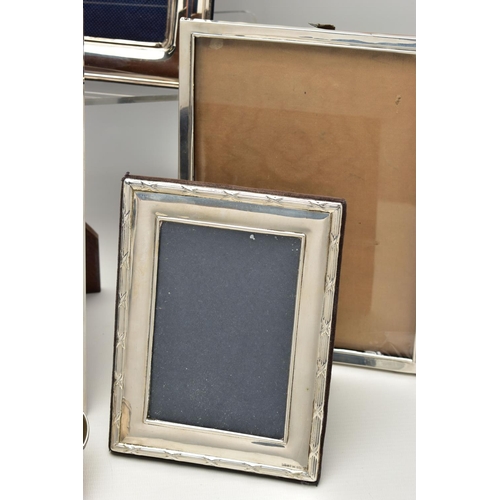 71 - TWELVE SILVER PHOTOGRAPH FRAMES AND TWO SMALL SILVER PLATED BOWLS, all of the photograph frames are ... 