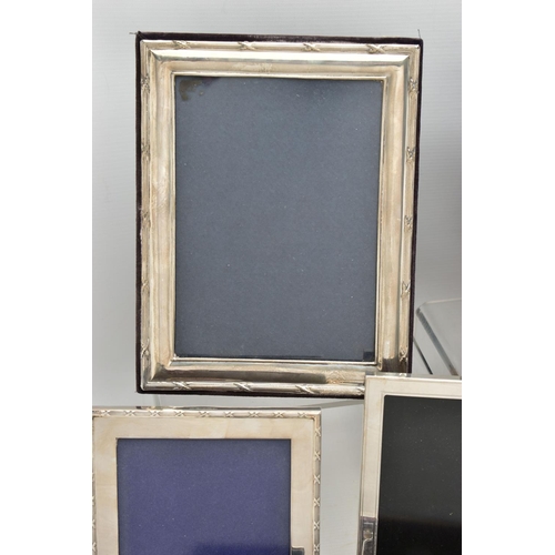 71 - TWELVE SILVER PHOTOGRAPH FRAMES AND TWO SMALL SILVER PLATED BOWLS, all of the photograph frames are ... 