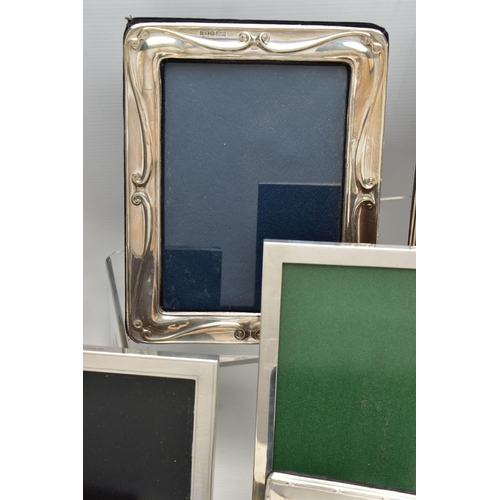 71 - TWELVE SILVER PHOTOGRAPH FRAMES AND TWO SMALL SILVER PLATED BOWLS, all of the photograph frames are ... 