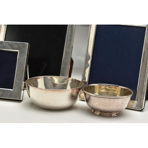 71 - TWELVE SILVER PHOTOGRAPH FRAMES AND TWO SMALL SILVER PLATED BOWLS, all of the photograph frames are ... 