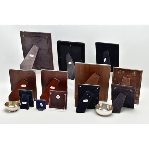 71 - TWELVE SILVER PHOTOGRAPH FRAMES AND TWO SMALL SILVER PLATED BOWLS, all of the photograph frames are ... 