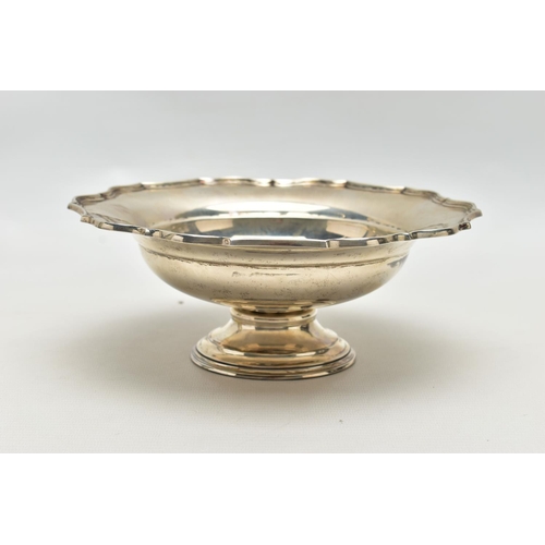 74 - A GEORGE V SILVER PEDESTAL bowl, with pie crust rim, dished centre, on a short pedestal with stepped... 