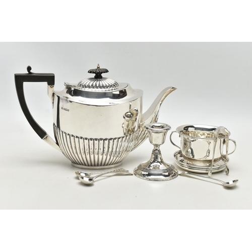 80 - A GEORGE V SILVER TEA POT OF OVAL FORM, domed cover with reeded detail, ebonised fitments, the lower... 