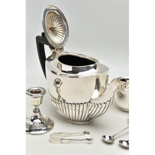 80 - A GEORGE V SILVER TEA POT OF OVAL FORM, domed cover with reeded detail, ebonised fitments, the lower... 