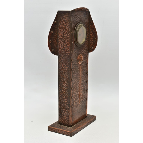 158 - AN ARTS AND CRATFS COPPER MANTEL CLOCK, the shaped rectangular case embossed with planished style fi... 