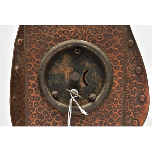 158 - AN ARTS AND CRATFS COPPER MANTEL CLOCK, the shaped rectangular case embossed with planished style fi... 