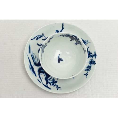 163 - AN 18TH CENTURY WORCESTER PORCELAIN TEA BOWL AND SAUCER PAINTED WITH THE PRUNUS ROOT PATTERN IN UNDE... 