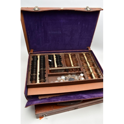 168 - AN EARLY 20TH CENTURY MAHOGANY CASED OPTOMETRIST SET, the interior fitted with a selection of lenses... 