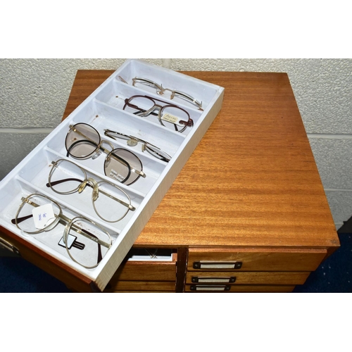 169 - OPTOMETRIST INTEREST: A 1960'S /70'S TEAK CHEST OF TWENTY-FOUR SHORT DRAWERS, each drawer with filin... 