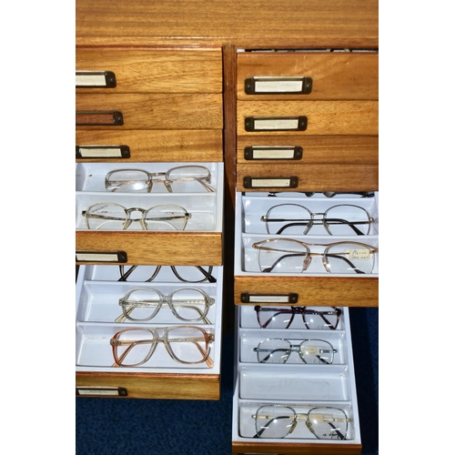 169 - OPTOMETRIST INTEREST: A 1960'S /70'S TEAK CHEST OF TWENTY-FOUR SHORT DRAWERS, each drawer with filin... 