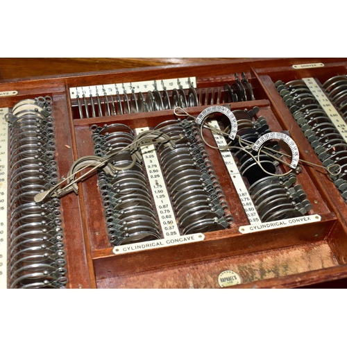 170 - OPTOMETRIST INTEREST: AN EARLY 20TH CENTURY RECTANGULAR OAK CABINET WITH GLAZED CASE ABOVE NINE DRAW... 