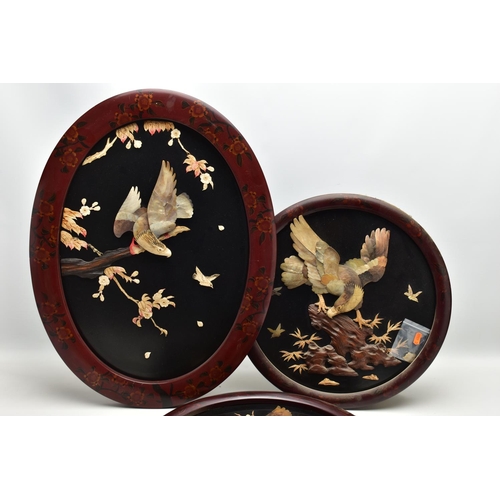 171 - A PAIR OF EARLY 20TH CENTURY SHIBAYAMA CIRCULAR PANELS AND ANOTHER SIMILAR OVAL, all three depicting... 