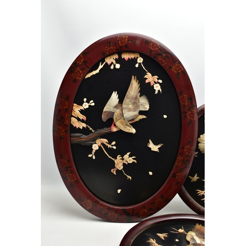 171 - A PAIR OF EARLY 20TH CENTURY SHIBAYAMA CIRCULAR PANELS AND ANOTHER SIMILAR OVAL, all three depicting... 