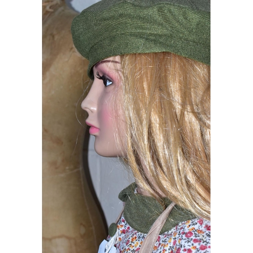 172 - A SECOND HALF 20TH CENTURY YOUNG GIRL PLASTIC SHOP MANNEQUIN ON A GLASS BASE, dressed as a 1940's ev... 