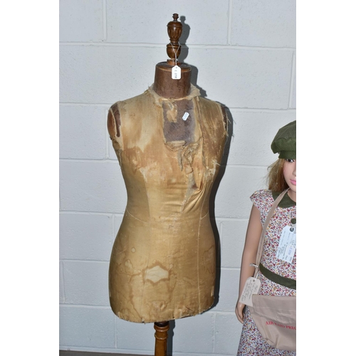 172 - A SECOND HALF 20TH CENTURY YOUNG GIRL PLASTIC SHOP MANNEQUIN ON A GLASS BASE, dressed as a 1940's ev... 