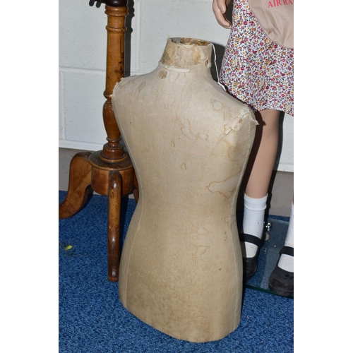 172 - A SECOND HALF 20TH CENTURY YOUNG GIRL PLASTIC SHOP MANNEQUIN ON A GLASS BASE, dressed as a 1940's ev... 