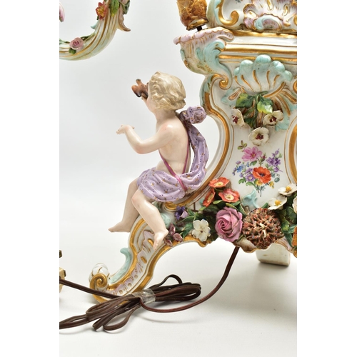 176 - A LATE 19TH CENTURY MEISSEN FIGURAL AND FLORAL ENCRUSTED CENTREPIECE ADAPTED TO A TABLE LAMP, the la... 