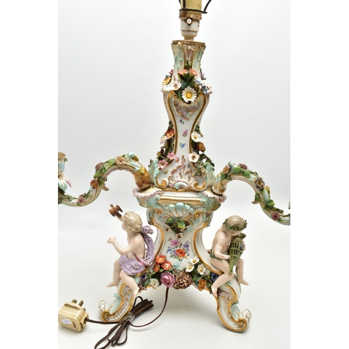 176 - A LATE 19TH CENTURY MEISSEN FIGURAL AND FLORAL ENCRUSTED CENTREPIECE ADAPTED TO A TABLE LAMP, the la... 