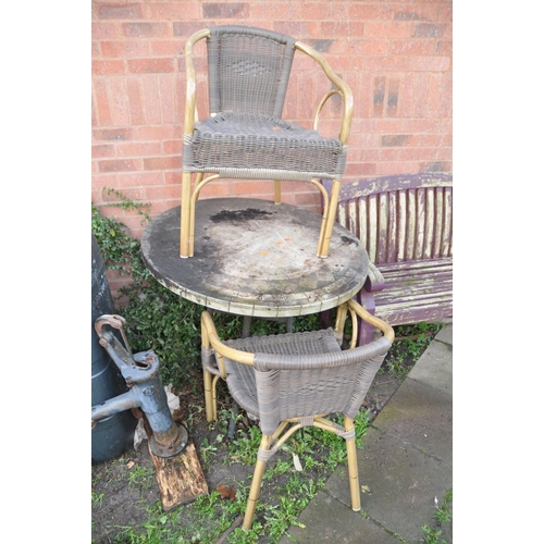 1005 - A HEAVY METAL FRAME CIRCULAR GARDEN TABLE  with a mineral effect top 90cm in diameter along with a p... 