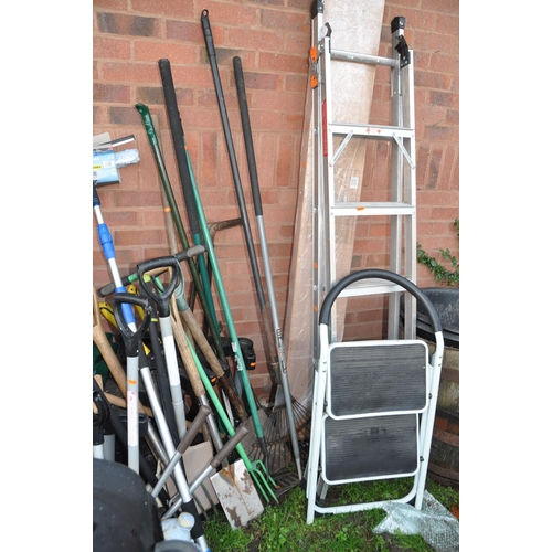 1008 - A LARGE QUANTITY OF GARDEN TOOLS AND FURNITURE including a boxed and unopened barbecue shelter, step... 