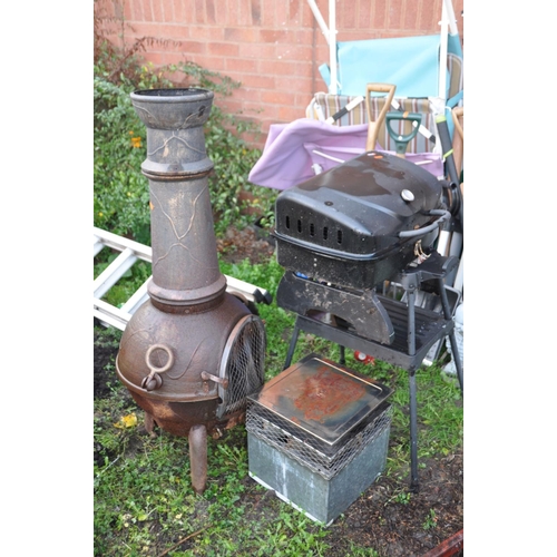 1012 - A CAST IRON CHIMONIERE 115cm high with a galvanised and polished flue cap along with a small barbecu... 