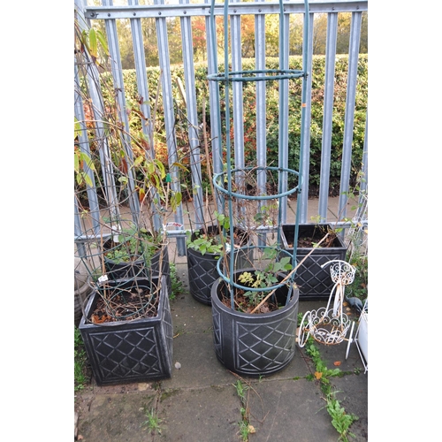 1016 - FIVE MODERN PLASTIC PLANTERS three tubular in construction 44cm in diameter and a pair of similar bu... 