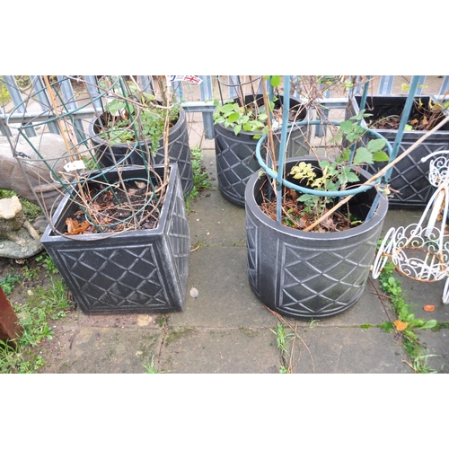 1016 - FIVE MODERN PLASTIC PLANTERS three tubular in construction 44cm in diameter and a pair of similar bu... 