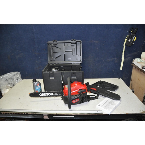 1094 - A MOUNTFIELD MC3720 PETROL CHAINSAW, with carrying case, engine and chain oils (engine pulls freely ... 