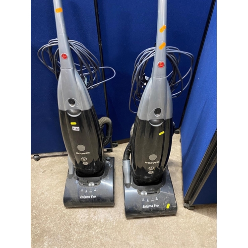 1112 - TWO HOOVER ENIGMA EVO VACUUM CLEANERS (both PAT pass and working but one brush bar noisy)