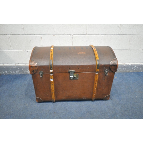 1245 - A VINTAGE CANVAS DOMED TRAVELING TRUNK, wooden banded, and leather corner patches, F.H.D. stamped to... 