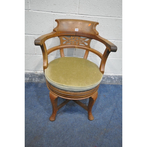 1250 - AN EARLY 20TH CENTURY OAK CAPTAINS CHAIR, with shaped raised back, and pierced details, swept open a... 