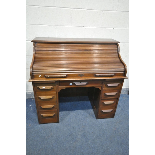 1262 - A 20TH CENTURY OAK ROLL TOP DESK, with fitted interior, eight various drawers, width 122cm x depth 6... 