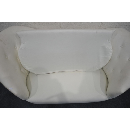 1281 - A BUTTONED TWIN SPOON BACK SOFA, upholstered in a white fabric, length 147cm (condition - ideal for ... 