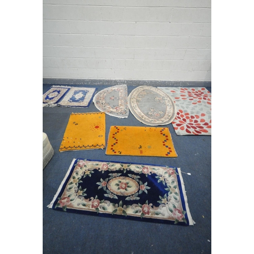 1292 - A SELECTION OF WOOLEN RUGS, to include five assorted chinse rugs (some with stains) a large patterne... 