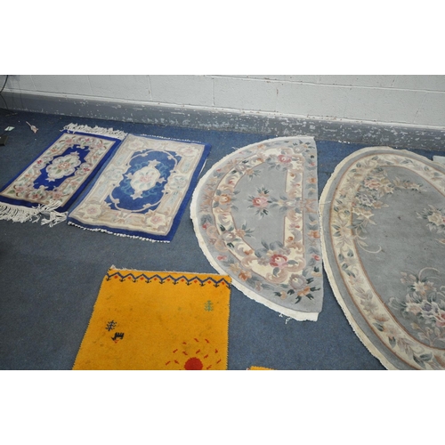 1292 - A SELECTION OF WOOLEN RUGS, to include five assorted chinse rugs (some with stains) a large patterne... 