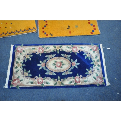 1292 - A SELECTION OF WOOLEN RUGS, to include five assorted chinse rugs (some with stains) a large patterne... 