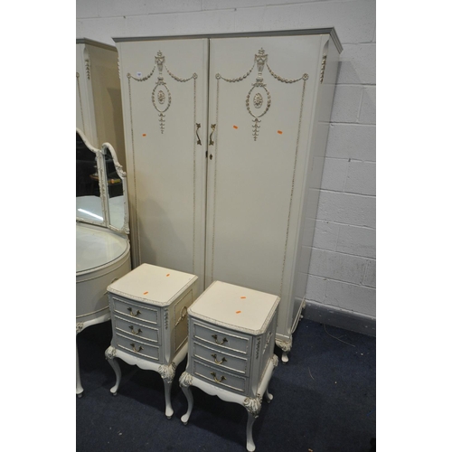 1307 - AN OLYMPUS FRENCH WHITE PAINTED FIVE PEICE BEDROOM SUITE, comprising two double door wardrobes, larg... 