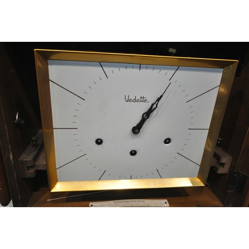 1321 - AN ART DECO WALNUT WALL CLOCK, labelled Vedette to the face, width 46cm x depth 17cm x height 35cm (... 