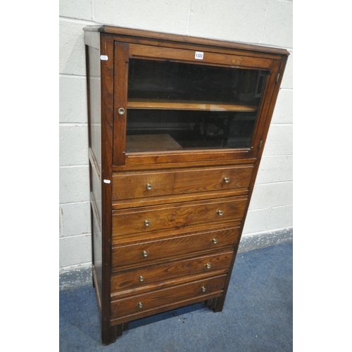 1322 - A 20TH CENTURY OAK CABINET, with a single glazed door, above five drawers, width 77cm x depth 46cm x... 