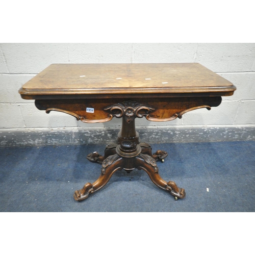 1334 - A VICTORIAN BURR WALNUT FOLD OVER CARD TABLE, with a circular green baize playing surface, with flor... 