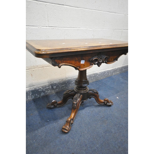 1334 - A VICTORIAN BURR WALNUT FOLD OVER CARD TABLE, with a circular green baize playing surface, with flor... 