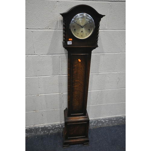 1335 - A 20TH CENTURY OAK CHIMING GRANDDAUGHTER CLOCK, height 148cm, with pendulum (condition:-good conditi... 