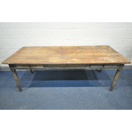 1339 - A 19TH CENTURY FARMHOUSE TABLE, the pine top with penny slots, three frieze drawers, on an oak base,... 