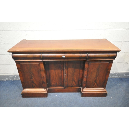 1374 - A VICTORIAN MAHOGANY SIDEBOARD, with three drawers and cupboard doors, on a plinth base, length 155c... 