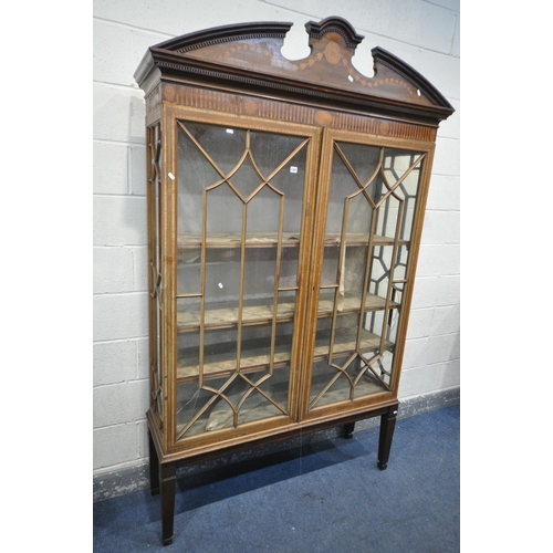 1397 - AN EDWARDIAN MAHOGANY AND MARQUETRY INLAID ASTRAGAL GLAZED TWO DOOR BOOKCASE, with a swan neck pedim... 