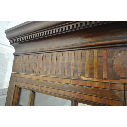 1397 - AN EDWARDIAN MAHOGANY AND MARQUETRY INLAID ASTRAGAL GLAZED TWO DOOR BOOKCASE, with a swan neck pedim... 