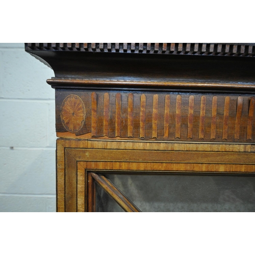 1397 - AN EDWARDIAN MAHOGANY AND MARQUETRY INLAID ASTRAGAL GLAZED TWO DOOR BOOKCASE, with a swan neck pedim... 