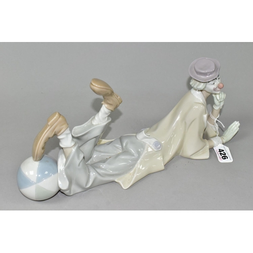 426 - A LLADRO CLOWN, no 4618, designed by Salvador Furio in 1970, the figure lying on his front with head... 