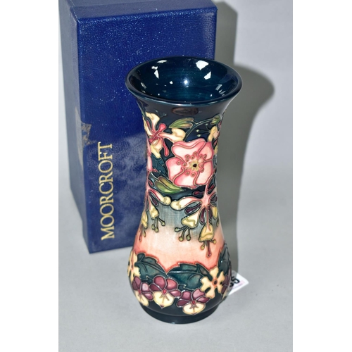 435 - A BOXED MOORCROFT POTTERY OBERON PATTERN VASE, of waisted form, with tube lined flowers and foliage ... 