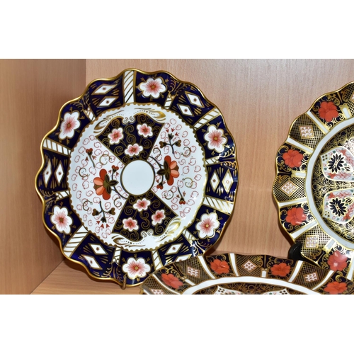 444 - A PAIR OF ROYAL CROWN DERBY OLD IMARI 1128 PLATES, WITH A TRADITIONAL IMARI 2451 PLATE, all having w... 